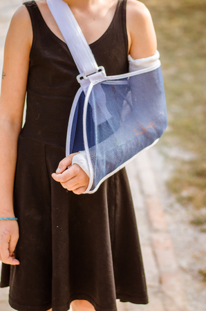 broken hand in gypsum bandageの写真素材