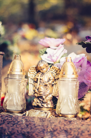 Colorful flower and candle decoration during All Saints Day at the cemeteryの写真素材