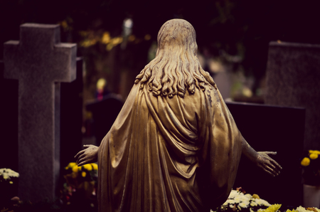 Jesus back view during All Saint Day  in autumn atmosphereの写真素材