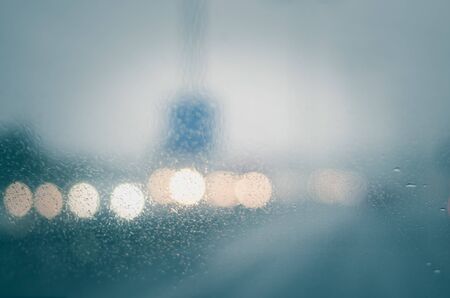 bokeh of car light in wet windscreen