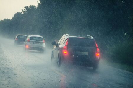 traffic in slippery and wet highway road in dangerous stormy and rainy weather