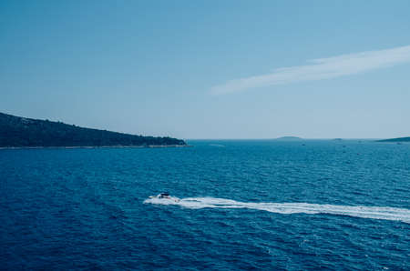 blue mediterranean sea in Croatia and orange sunset sceneryの写真素材