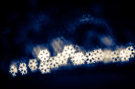 illuminated glittering bokeh with butterfly shape copy space backgroundの写真素材