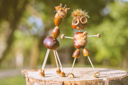 cute figures of pirate and hedgehog from autumnal fruits in vibrant autumnal colorsの写真素材
