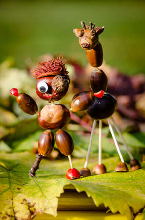 cute figures of pirate and hedgehog from autumnal fruits in vibrant autumnal colorsの写真素材