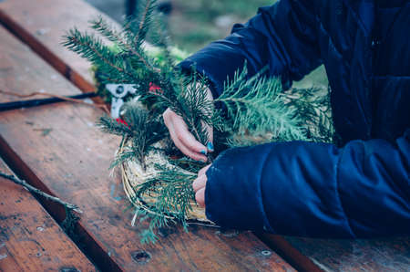 bird feeder made from plants and twigs with animal bird foodの写真素材