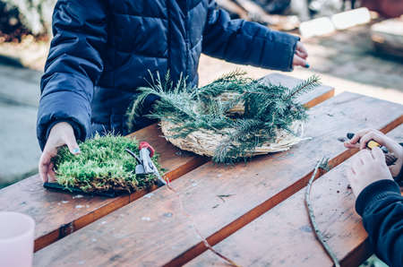 bird feeder made from plants and twigs with animal bird foodの写真素材