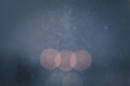 orange blue bokeh with blurred spots backgroundの写真素材