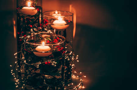 four burning candles with traditional festive cristian atmosphere full of light and magic