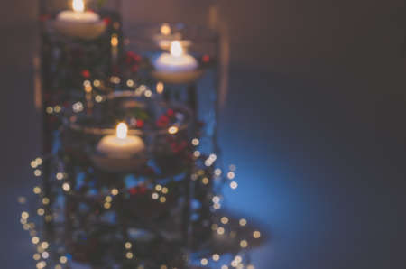 four burning candles with traditional festive cristian atmosphere full of light and magicの写真素材