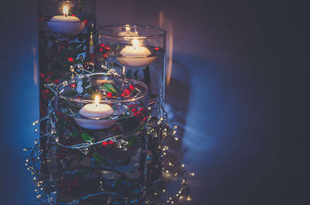 four burning candles with traditional festive cristian atmosphere full of light and magicの写真素材