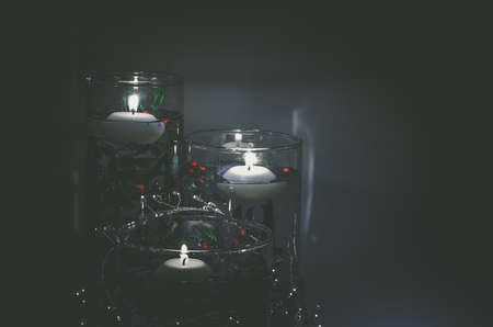 four burning candles with traditional festive cristian atmosphere full of light and magicの写真素材