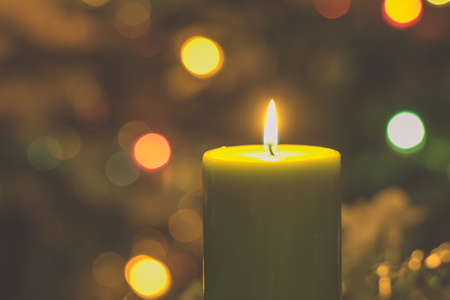 four burning candles with traditional festive cristian atmosphere full of light and magicの写真素材
