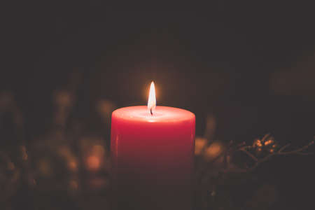 four burning candles with traditional festive cristian atmosphere full of light and magicの写真素材