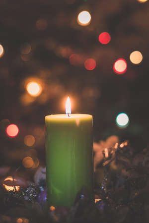 four burning candles with traditional festive cristian atmosphere full of light and magicの写真素材