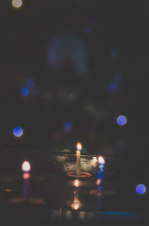 christmas tradition of nut shells floating on water surface, eastern Europe tradition with bokeh backgroundの写真素材