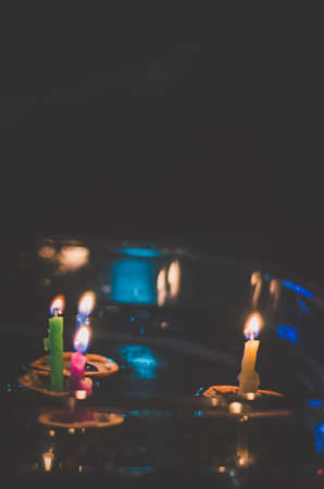 christmas tradition of nut shells floating on water surface, eastern Europe tradition with bokeh backgroundの写真素材