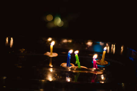 christmas tradition of nut shells floating on water surface, eastern Europe tradition with bokeh backgroundの写真素材