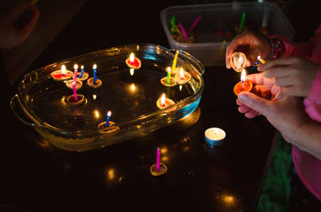 christmas tradition of nut shells floating on water surface, eastern Europe tradition with bokeh backgroundの写真素材