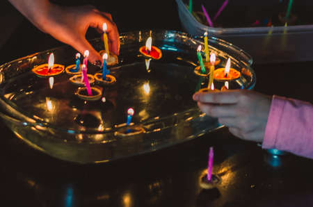 christmas tradition of nut shells floating on water surface, eastern Europe tradition with bokeh backgroundの写真素材