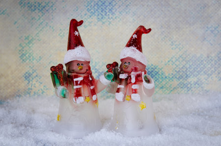 shining red christmas box with surprise inside in golden backgroundの写真素材
