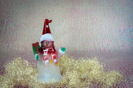 shining red christmas box with surprise inside in golden backgroundの写真素材