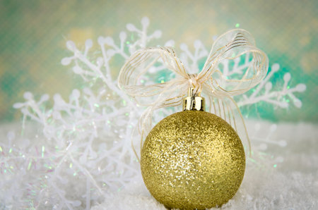 shining red christmas box with surprise inside in golden backgroundの写真素材
