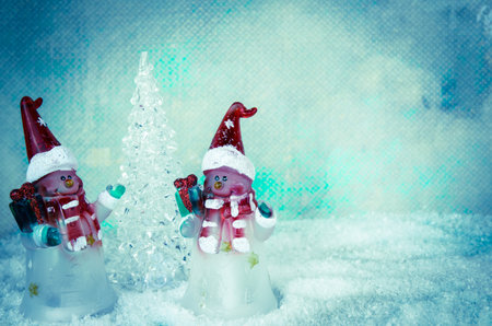 shining red christmas box with surprise inside in golden backgroundの写真素材
