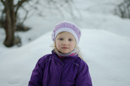 little lovely girl portrait in winter backgroundの写真素材