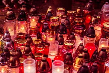 burning candles in colorful lanterns on the grave, candle backgroundの写真素材