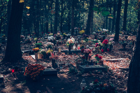 burning candles on decorated grave in the cemeteryの写真素材