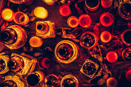 All Saints Day concept with burning candles background