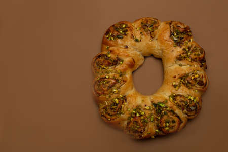 Easter roll with nuts. Brown background with free space for text.の写真素材
