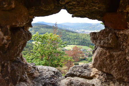 A view of green fields, forests and mountains in the Giant Mountains from above.の写真素材