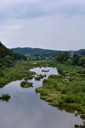 Bieszczady, a view of the artificial Solina lake, a Polish tourist attraction on a cloudy day during the holidays.の写真素材