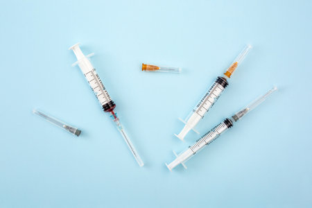 Syringes on blue backgroundの写真素材