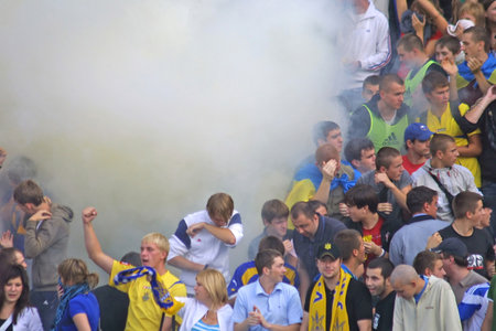 KYIV, UKRAINE - SEPTEMBER 05, 2009: Ukraine National Football team supporters burn the fires and react after scored against Andorra during 2010 FIFA World Cup qualifiers match in Kyiv on September 5, 2009のeditorial素材