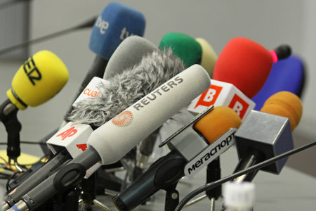 KIEV, UKRAINE - DECEMBER 8, 2009: Microphones on a table during press-conference before UEFA Champions League football match between Dynamo Kyiv and FC Barcelona on December 8, 2009 in Kievのeditorial素材