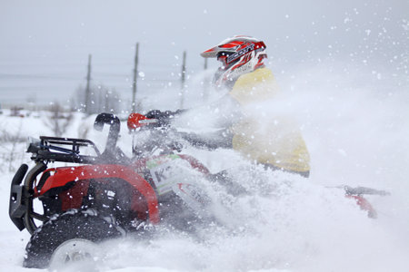 KYIV, UKRAINE - 13 FEBRUARY 2010: The quad bike's driver Mykhaylo Ersh (Yamaha Grizzly 660) rides...