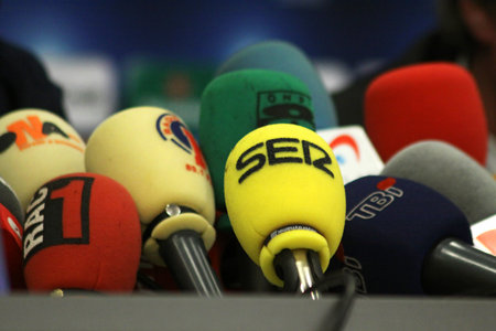 KYIV, UKRAINE - DECEMBER 8, 2009: Microphones on a table during press-conference before UEFA Champions League football match between Dynamo Kyiv and FC Barcelona on December 8, 2009 in Kyiv, Ukraineのeditorial素材