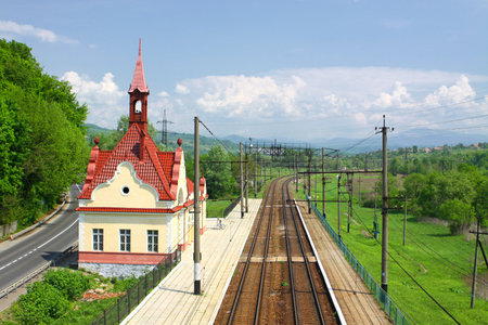 Railway tracks and small railway station in Carpathian mountains, Ukraineのeditorial素材