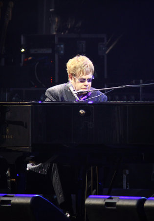KYIV, UKRAINE - JUNE 30, 2012: Singer Sir Elton John performs onstage during charity Anti-AIDS concert at the Independence Square on June 30, 2012 in Kyiv, Ukraineのeditorial素材