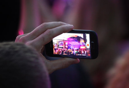 KYIV, UKRAINE - JUNE 30, 2012: People take a pictures during charity Anti-AIDS concert at the Independence Square on June 30, 2012 in Kyiv, Ukraineのeditorial素材