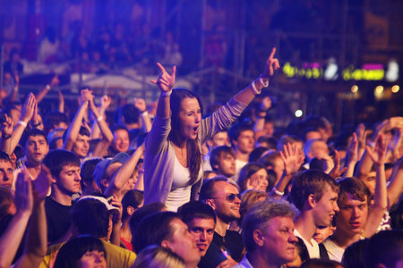 KYIV, UKRAINE - JUNE 30, 2012: People dance during Queen performs onstage at charity Anti-AIDS concert at the Independence Square on June 30, 2012 in Kyiv, Ukraineのeditorial素材