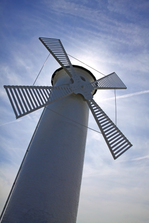 Close up white old lighthouse windmill in Swinoujscie, Baltic Sea, Polandの写真素材