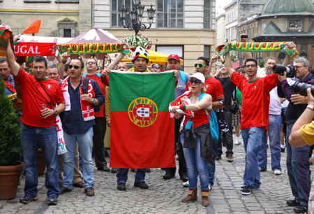 LVIV, UKRAINE - 9 JUNE, 2012  Portugal football team supporters walk on a streets of Lviv city before UEFA EURO 2012 game against Germany on 9 June, 2012 in Lviv, Ukraineのeditorial素材