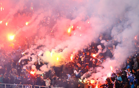 KYIV, UKRAINE - OCTOBER 20, 2013  Dynamo Kyiv ultra supporters perform during Ukraine Championship game against Arsenal on October 20, 2013 in Kyiv, Ukraineのeditorial素材
