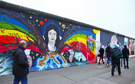 BERLIN - NOVEMBER 10, 2013  People walking near East Side Gallery on November 10, 2013 in Berlin,...