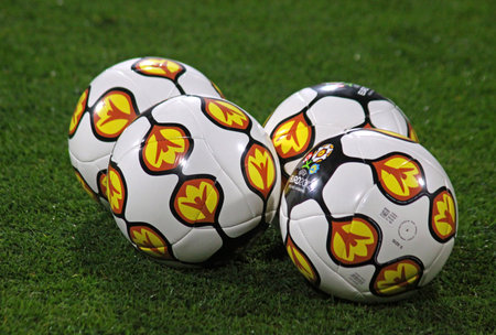 KYIV, UKRAINE - OCTOBER 8, 2010  Close-up official UEFA EURO 2012 balls on the grass during friendly...