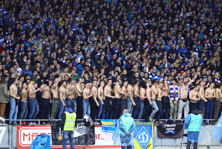 KYIV, UKRAINE - APRIL 16, 2014  FC Dynamo Kyiv team supporters show their support during Ukraine Championship game against Shakhtar Donetsk at NSC Olimpiyskiy stadium in Kyivのeditorial素材